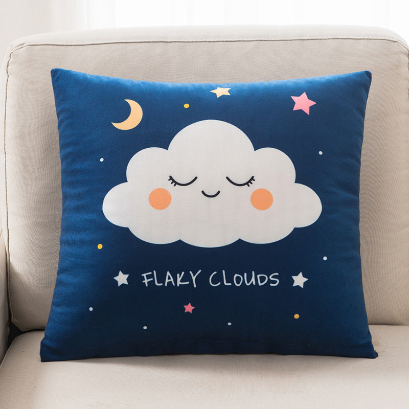 Decorative pillow with a cloud design on a beige couch