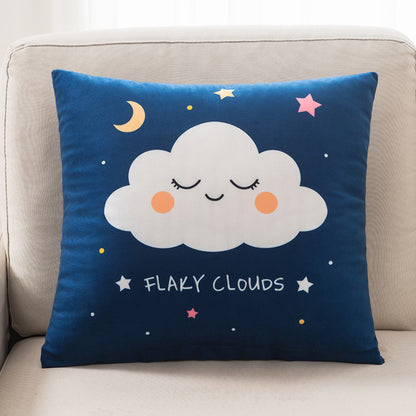 Decorative pillow with a cloud design on a beige couch