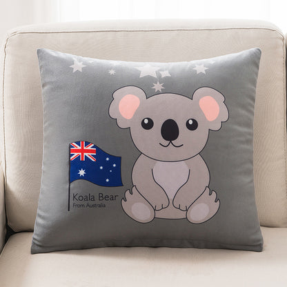 Gray pillow with a koala bear design and Australian flag on a beige couch.