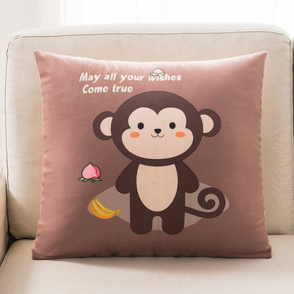 Decorative pillow with a monkey design and text on a beige couch.